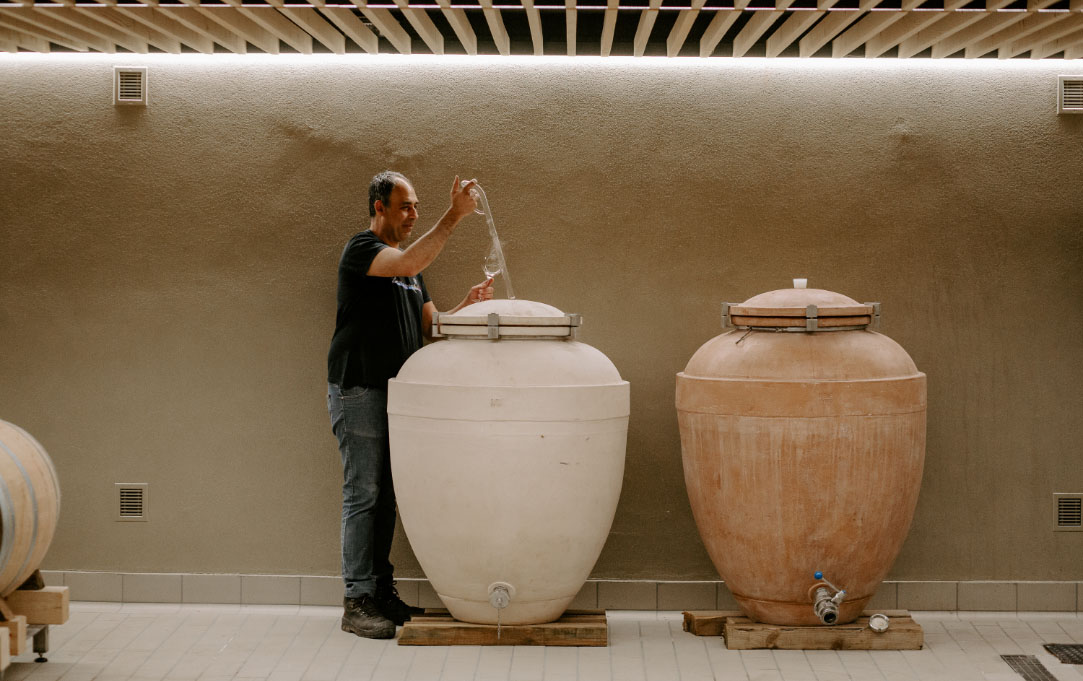 Tasting fermenting wine from a clay amphora (Photo: Ktima Tselepos)